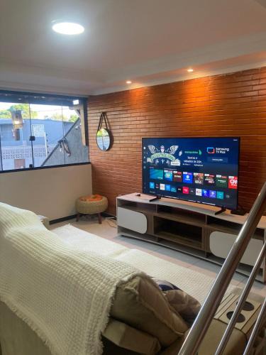 Praia de Capuaba House | 50 metros da praia,Ar condicionado na sala de estar e suíte, Área Gourmet