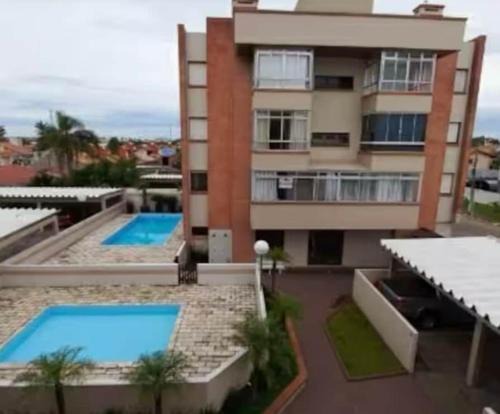 Arroio Teixeira Apartment | Aconchegante apartamento 2 dormitórios, sendo uma suíte, com piscina