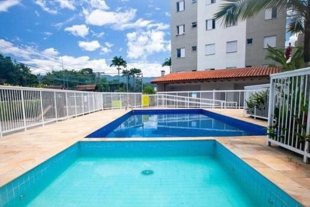 Estufa I Apartment | Apartamento Ubatuba - Ar Condicionado, Estacionamento, Elevador, Portaria 24h - WiFi Grátis! - Jardim das Palmeiras