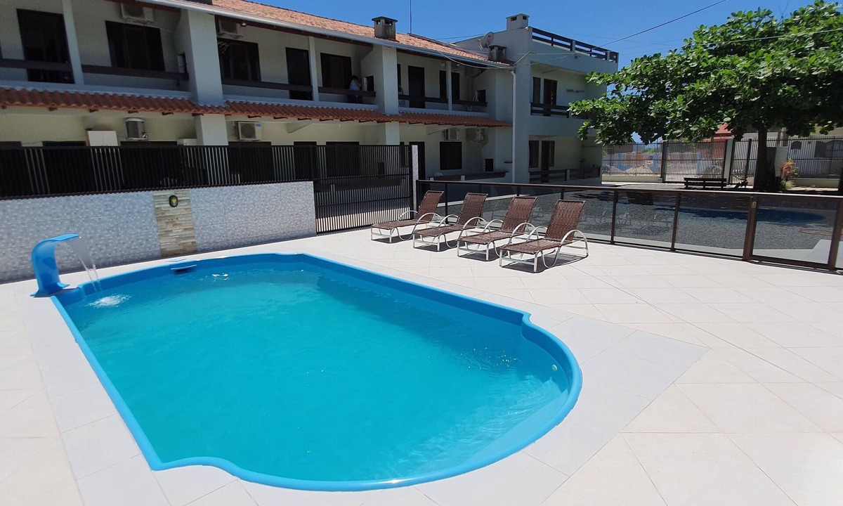 Itapoa Apartment | Apartment in a gated community with a swimming pool.