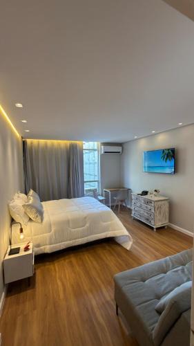 Aparecida Apartment | Apto 711 - Elegância com vista parcial da Praia