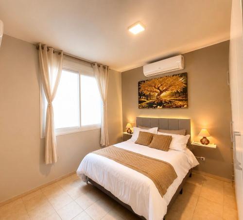 Capao da Canoa Apartment | Apto no centro - Praça Mini Golf - Sacada - Garagem - 300m do Mar - Térreo