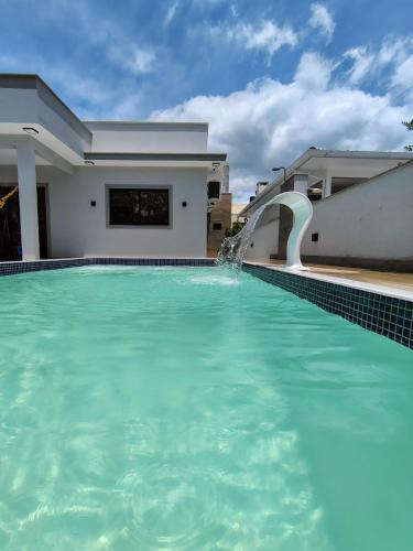 Palhoca House | Casa com piscina praia da Pinheira - Brisa das Amendoeiras