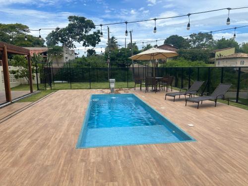 Guarapari House | Casa de alto padrão com piscina,quadra e jacuzzi em condomínio