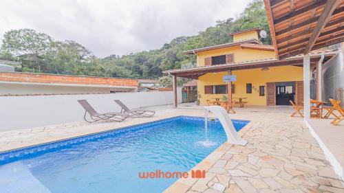 Horto House | Casa em Ubatuba com churrasqueira e varanda ampla