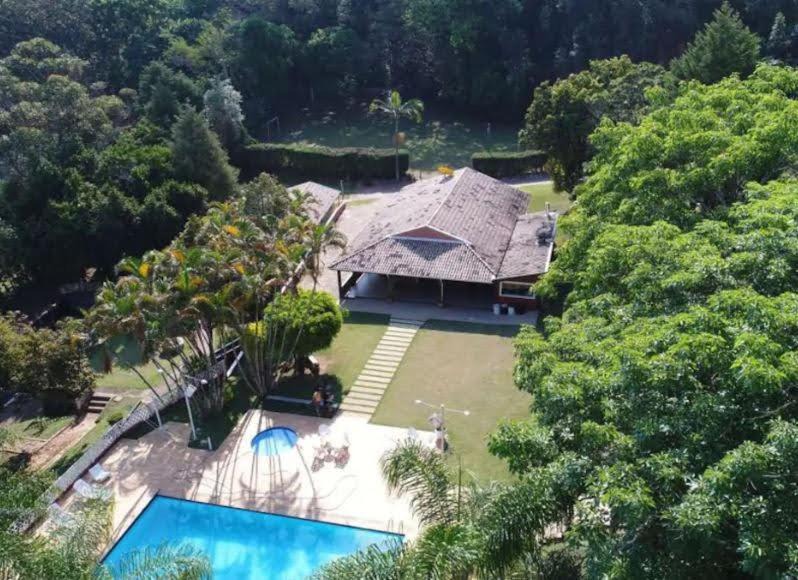 Jardim Primavera Cabin | Casa Guacuri - Casa de temporada e eventos - apartamentos com suítes - Piscinas e Amplo Estacionamento
