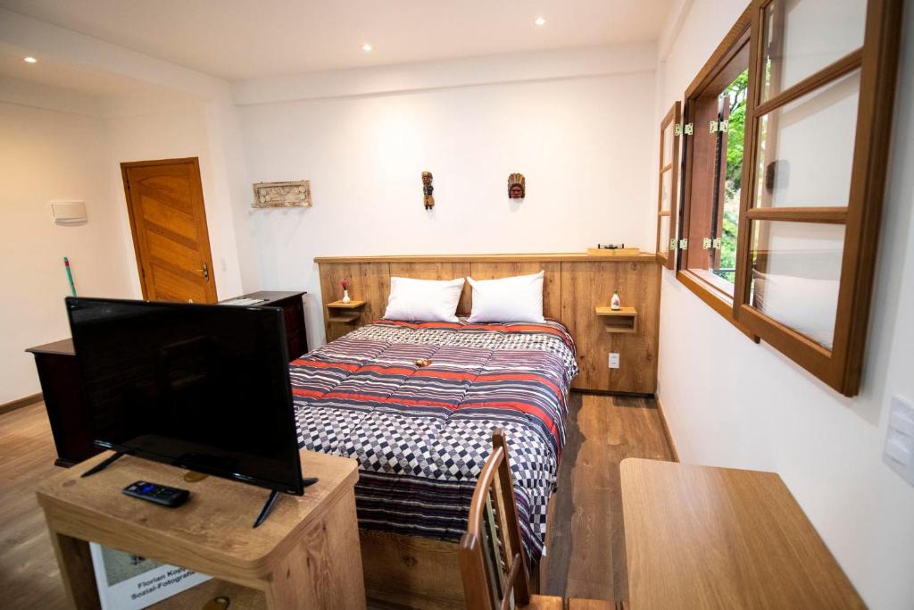 Petropolis Apartment | Casa Lucas - loft espaçoso com jardim e churrasqueira