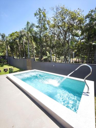 Estaleiro House | Casa Woods seu Refúgio na Praia do Estaleiro