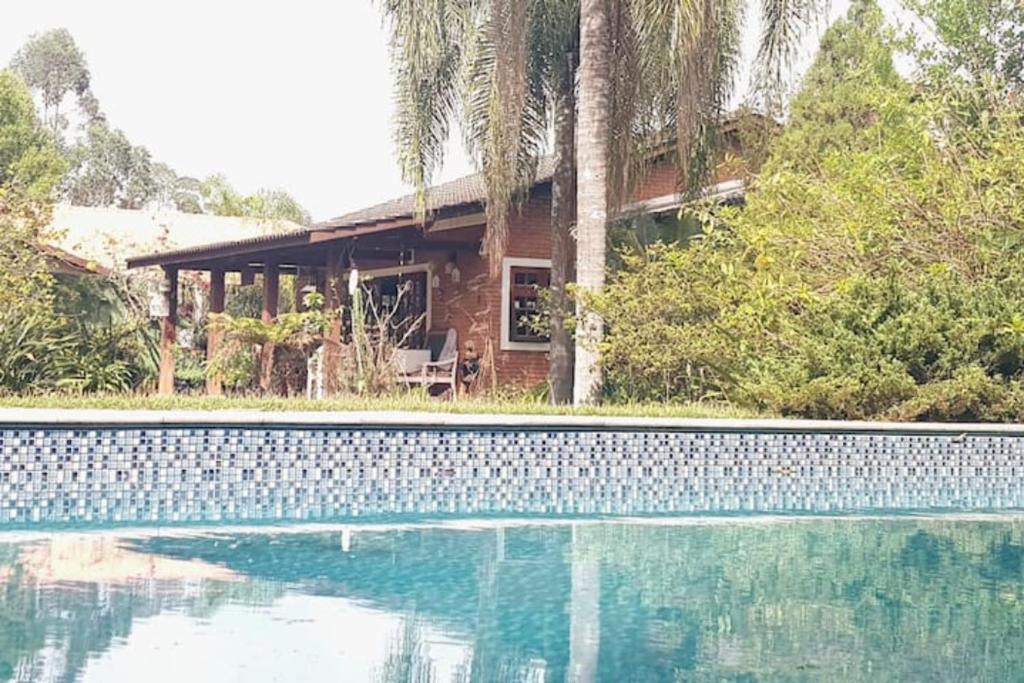 Condominio Vila Verde Villa | LINDA CHACARA EM CONDO A 40 MIN DE SP com piscina climatizada, churrasqueira, wifi, 5 quartos e muita natureza