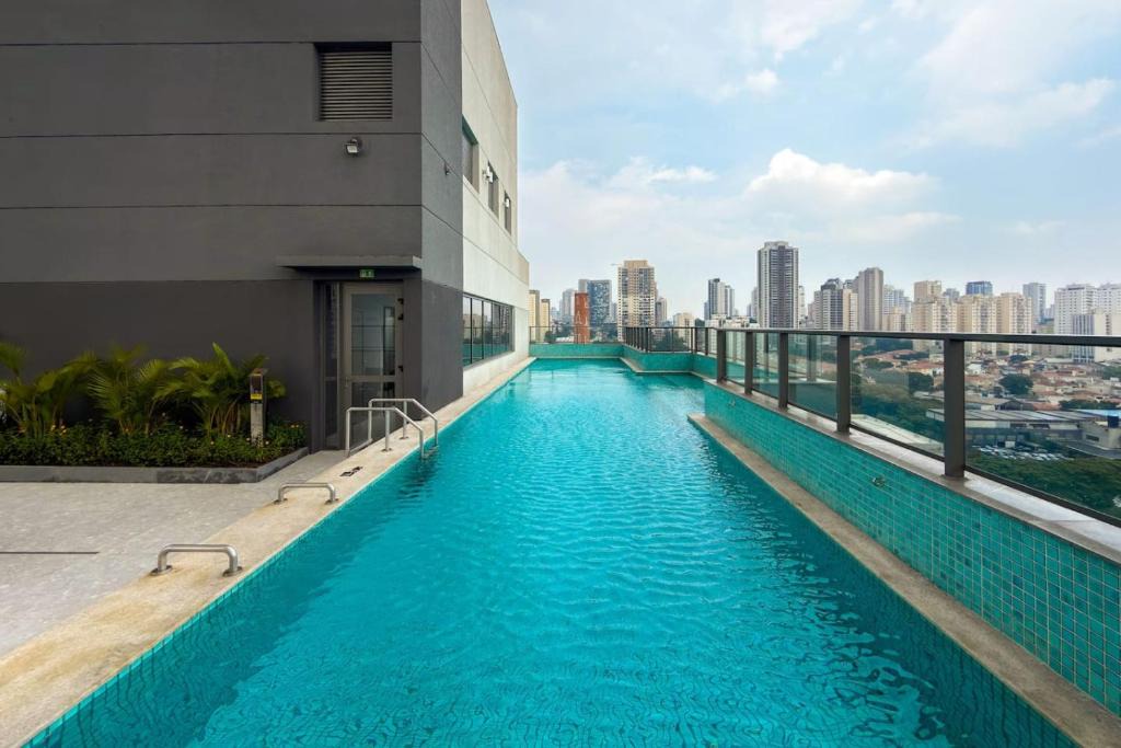 Sao Paulo Apartment | Modern studio with balcony and washer-dryer, near Expo SP