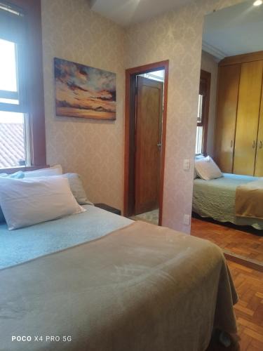 Savassi House | Quarto Suite -Em apartamento familiar