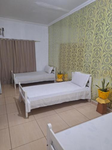 Alvorada House | Quarto triplo com banheiro compartilhado