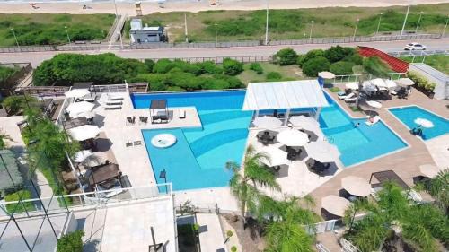 Itacolomi Apartment | Apê Beira Mar com Ar Cond em Condomínio Clube com Piscina, Churrasqueira, Proximo ao Beto Carrero