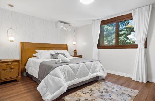 Bairro Lago Negro Apartment | Apartamento Grunerberg 3 Suítes by Achei Gramado