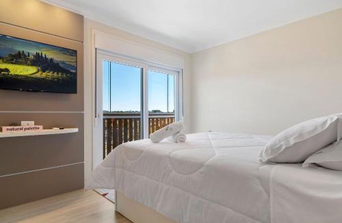 Canela Apartment | Apartamento HodsPrime com 2 Suítes by Achei