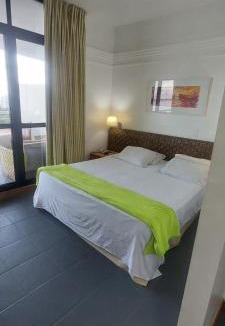 Ponta Negra Apartment | Apartamento no tropical executive hotel com varanda, 1 cama de casal e 2 camas de solteiro