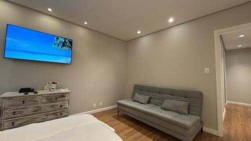 Aparecida Apartment | Apto 711 - Elegância com vista parcial da Praia