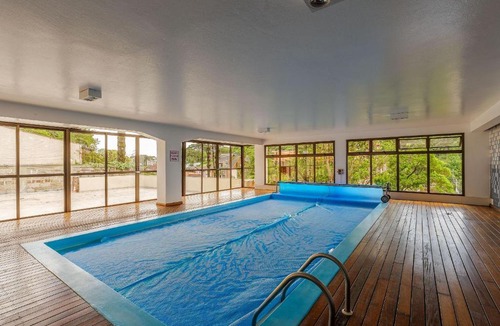 Floresta Apartment | Apto no Centro e Piscina aquecida by Achei Gramado