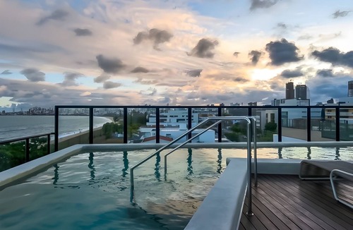 Jardim Oceania Apartment | Beachfront Gourmet Studio with Private Pool