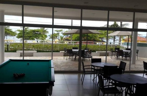 Praia Grande Apartment | Beautiful apartment with excellent ocean views, featuring hot and cold swimming pools.