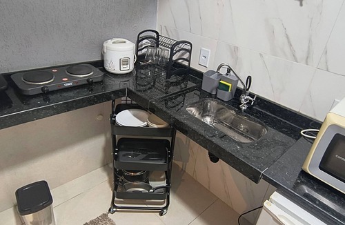 Sao Pedro da Aldeia Apartment | Suite with Air Conditioning and Kitchen | Practicality and Comfort in São Pedro da Aldeia