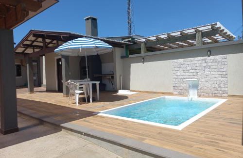 Capao da Canoa House | Casa com piscina, Ar condicionado, Pertinho Do Mar Em Capão Da Canoa