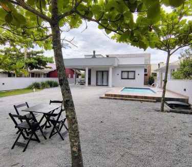 Palhoca House | Casa com piscina praia da Pinheira - Brisa das Amendoeiras
