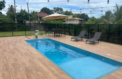 Guarapari House | Casa de alto padrão com piscina,quadra e jacuzzi em condomínio