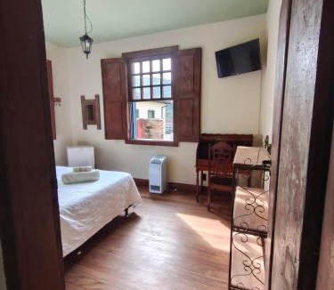 Ouro Preto Hotel | CASA RAIZ cama café e prosa