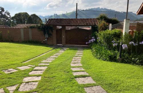 Goncalves Apartment | Chalé das Flores - Refúgio com clima de chácara no Centro de Gonçalves