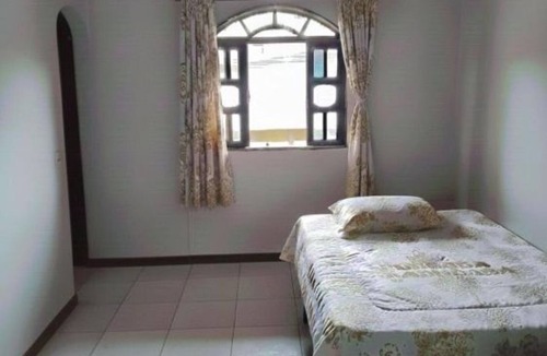 Pereque House | Comfortable accommodation with air conditioning and a fan. Well-Maintained Suite #3