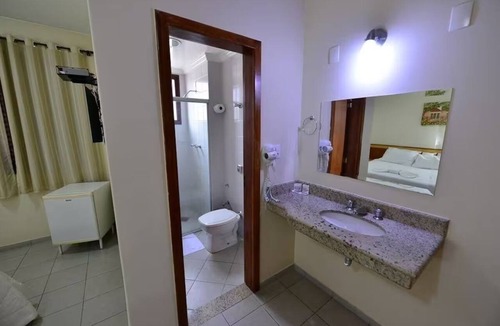 Caratinga Hotel | Enjoy Tranquility in Gorgeous Unit Designed for Total Comfort | Onsite Pool