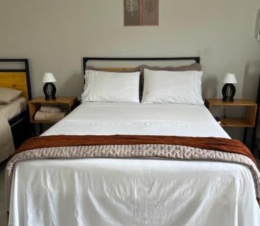 Jardim Ipe Apartment | Flat com ar, varanda e linda vista para o Ibituruna - Pico do Ibituruna - 201