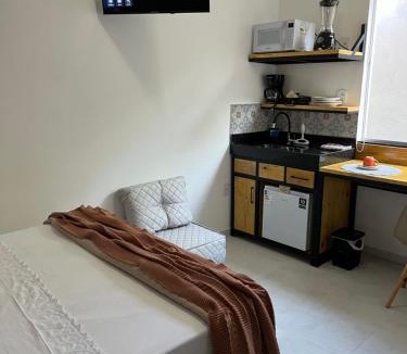 Jardim Ipe Apartment | Flat com ar e varanda com linda vista para o Ibituruna, Wi-Fi - Véu de Noiva 204