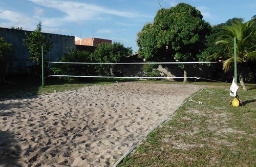 Praia da Vila House | House surrounded by a veranda, swimming pool, barbecue area, and volleyball/beach tennis court.