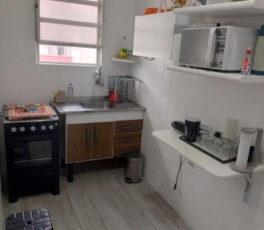 Boqueirao Apartment | Kitnet aconchegante no centro, a poucos passos da praia