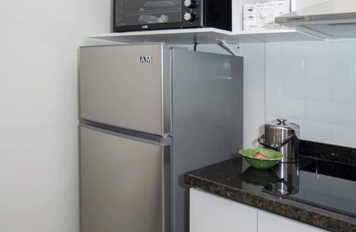 Asuncion Apartment | Light-Filled 1BR with Pool & Gym Access