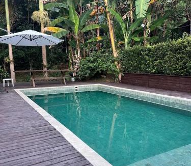 Gaspar Grande House | Pool amid the green