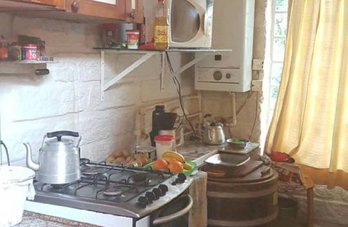 Sao Francisco de Paula House | Rustic Stone House in a Gated Community.