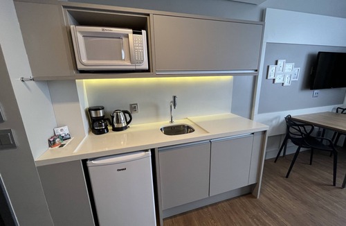 Batel Apartment | Studio Helbor Stay Batel - Aconchegante com Localização Premium