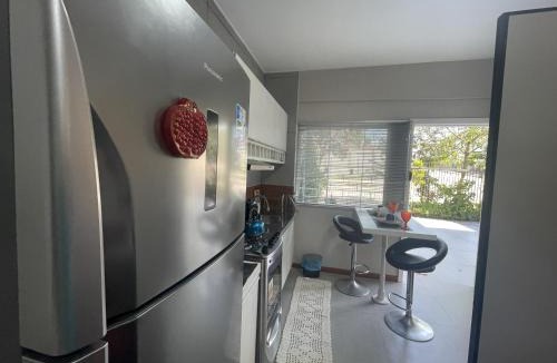 Novo Mundo Apartment | Studio Romã térreo com cozinha
