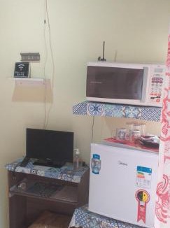 Praia da Enseada Apartment | Suíte externa com entrada independente