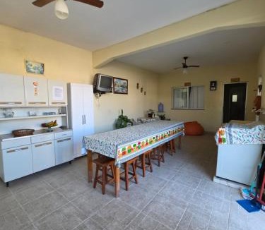 Piuma House | Suíte independente com cozinha e varanda