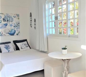 Praia Rasa Apartment | SUITE DA FRENTE COM COPA, WIFI E ACESSO INDEPENDENTE