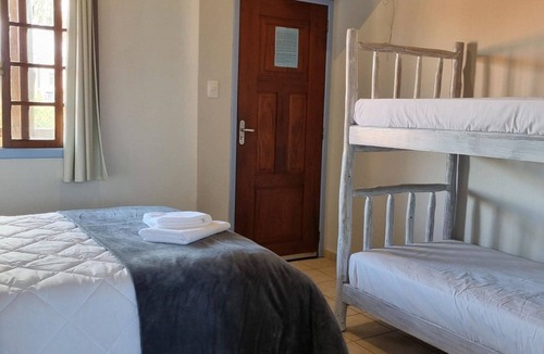 Garopaba House | Suite Térrea Premium - Pousada Buena Onda - SC