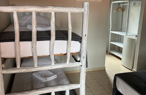 Garopaba House | Suite Térrea Premium - Pousada Buena Onda - SC