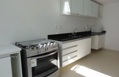 Juquehy Condo | Tasteful design at the Raízes de Juquehy Condominium, one block from the beach.