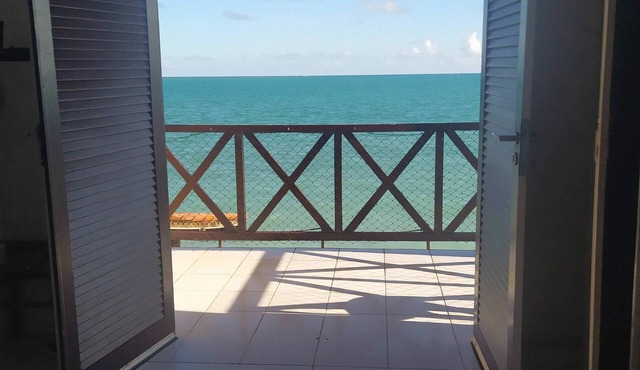A private chale less than 20 feet from the ocean