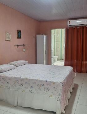 Aconchego da Marci Grande quarto confortável