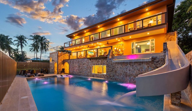BEACH Castle w/WATERSLIDE, WATERFALL, 2 Pools on SANDY BEACHFRONT August Discount!